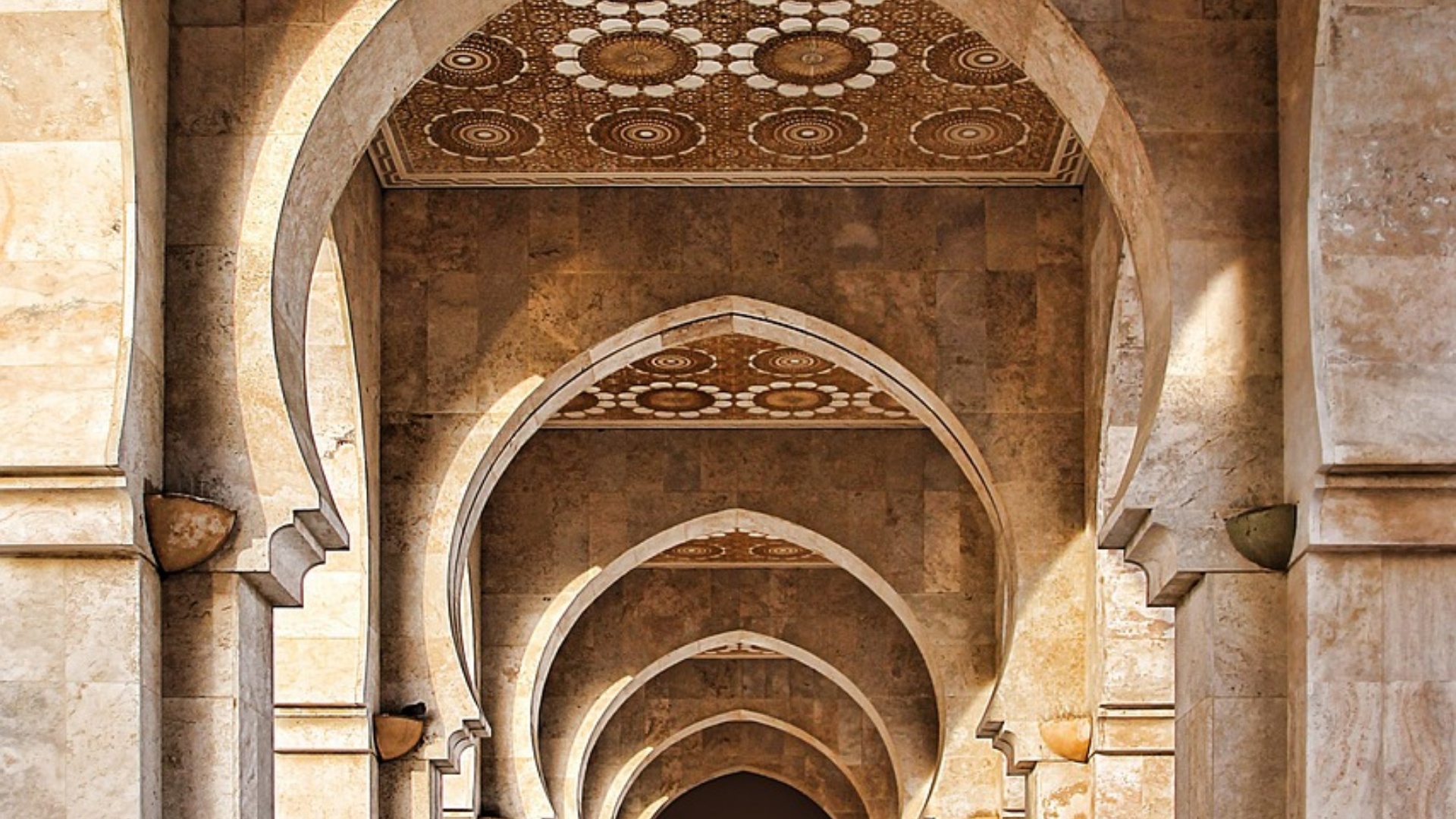 A corridor of stone arches symbolizing structure and progression—used to illustrate how strategic workforce planning requires HR maturity.